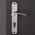 Poignée de porte d'entrée en aluminium nickel mat sur plaque ronde Clé I, EVA
